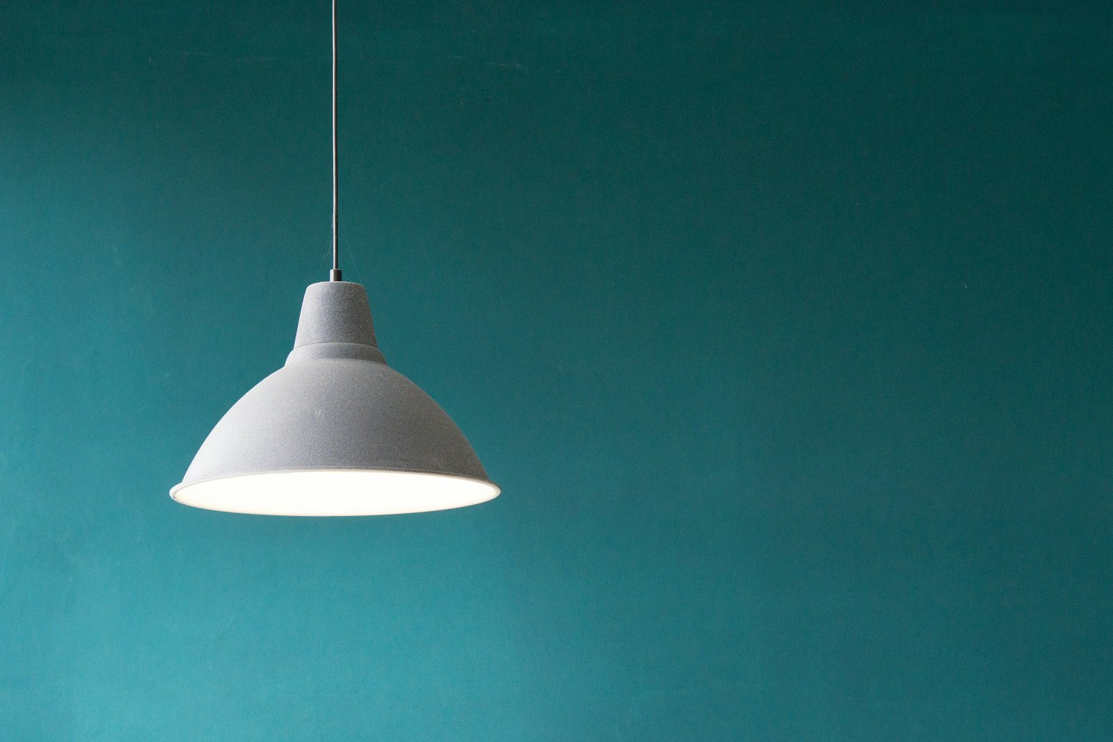 Warm pendant light illuminating a calm living room