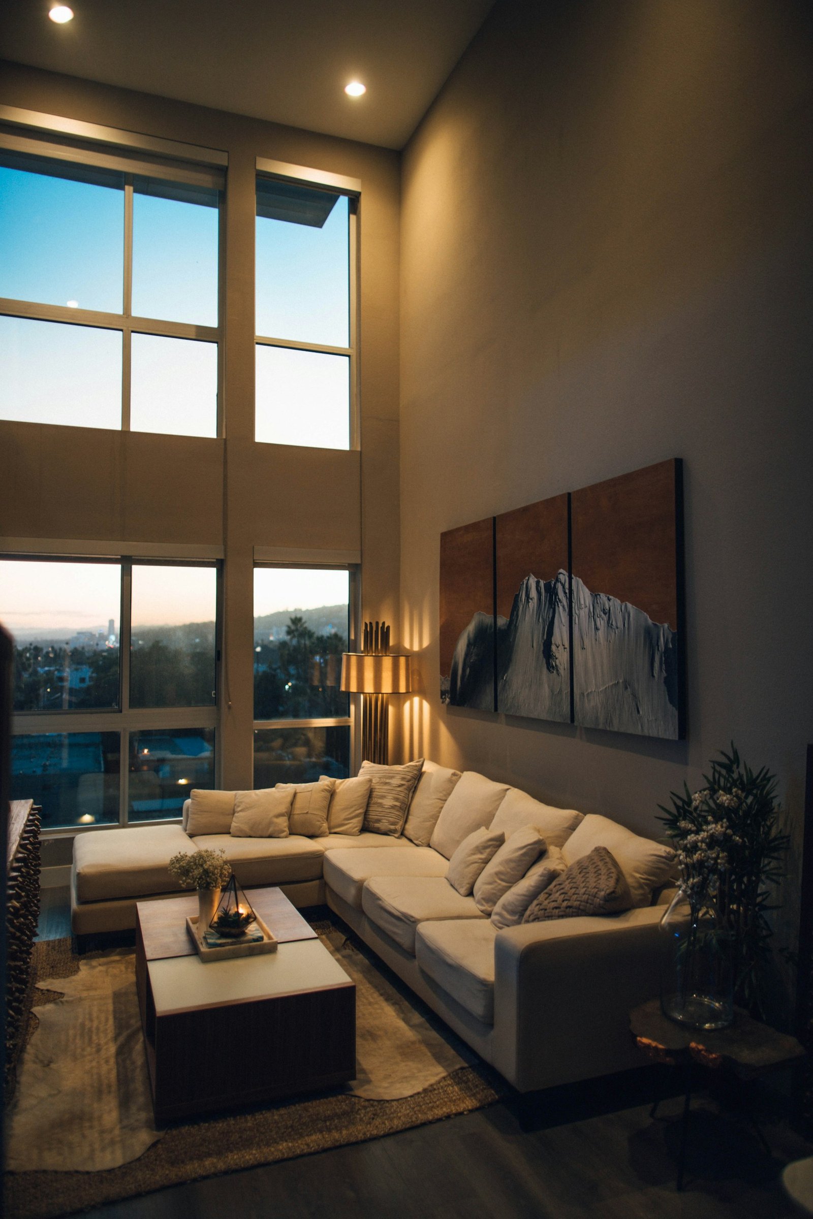 Warm bedside lighting in a bedroom at dusk